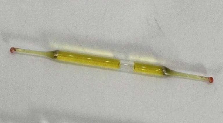What could this be? Found beneath a bathroom vanity during renovations—tiny glass tubes, roughly 2 inches long, containing liquid. Any thoughts?